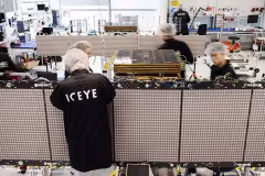 ICEYE staff assembling a SAR satellite in a clean room