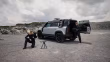 ICEYE / Nokia satellite terminal on tripod next to a Land Rover Defender