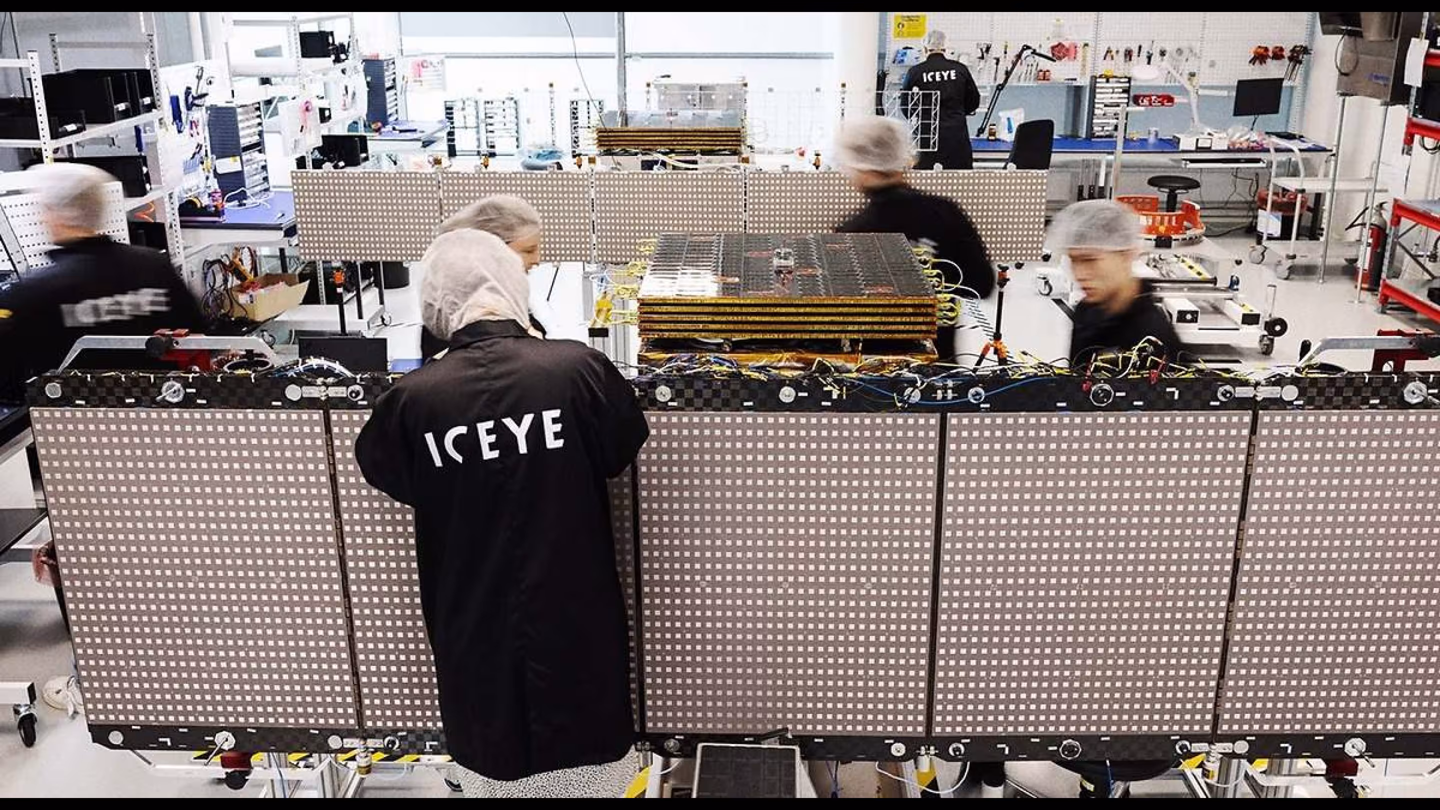 ICEYE staff assembling a SAR satellite in a clean room