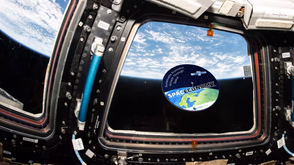 SpacEconomy sticker at ISS cupola (not real)